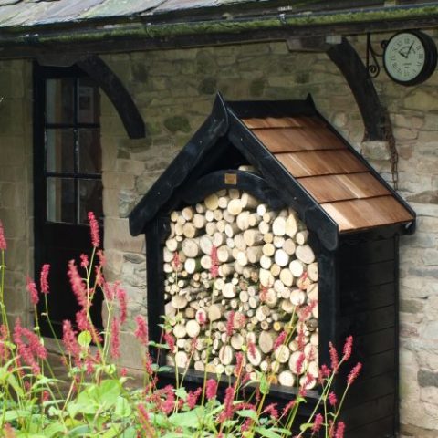 Wooden Gothic Log Store with cedar roof shingles