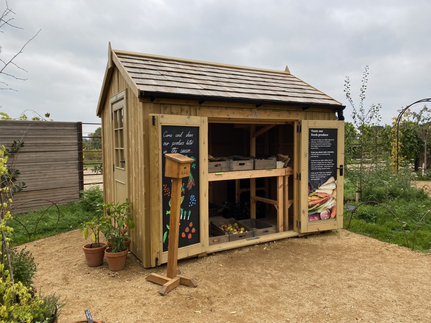 The Bespoke Potting Shed displaying produce grown in the World Food Garden