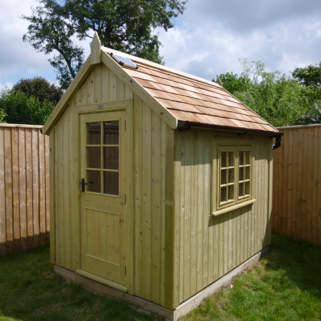 Potting shed with felt shingles on roof
