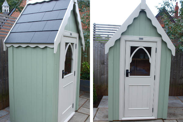 small painted shed with pretty gothic windows