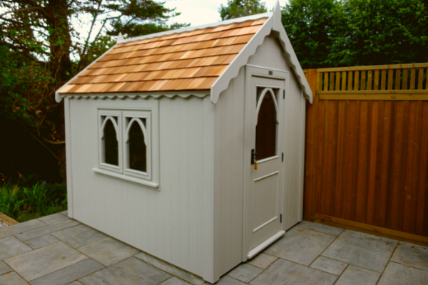 large gothic shed with cedar roof