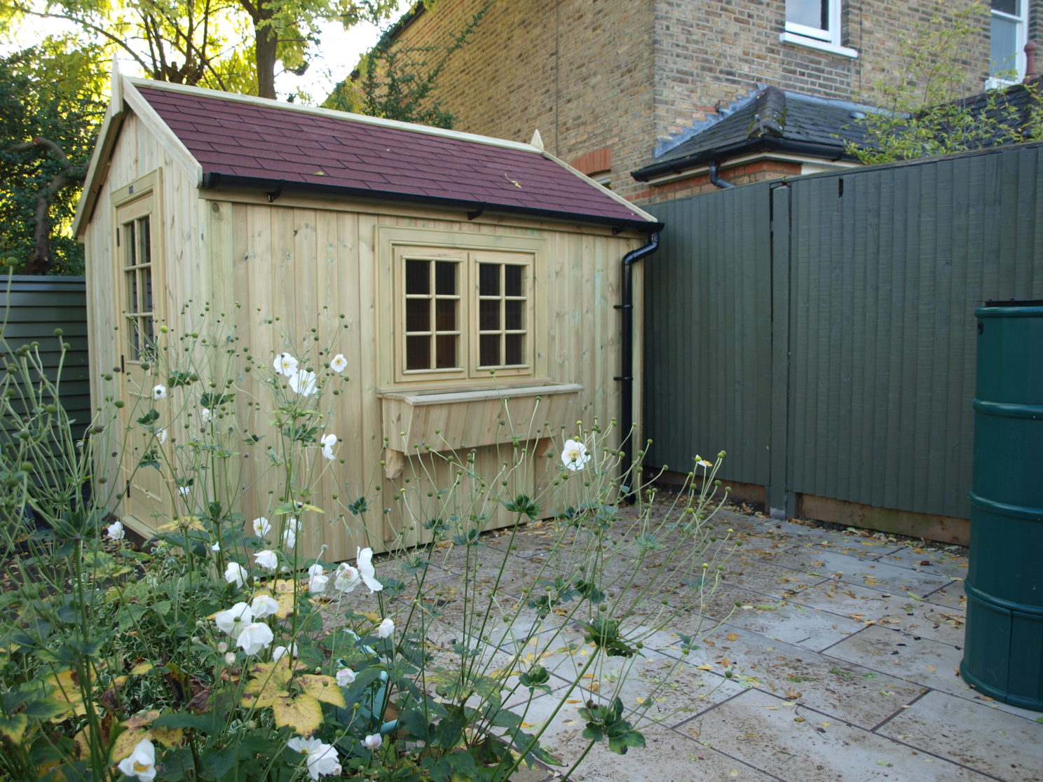 large potting shed with window box