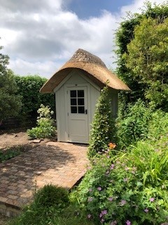 Posh Shed with thatched roof
