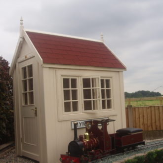 Miniature train signal box with felt shingled roof