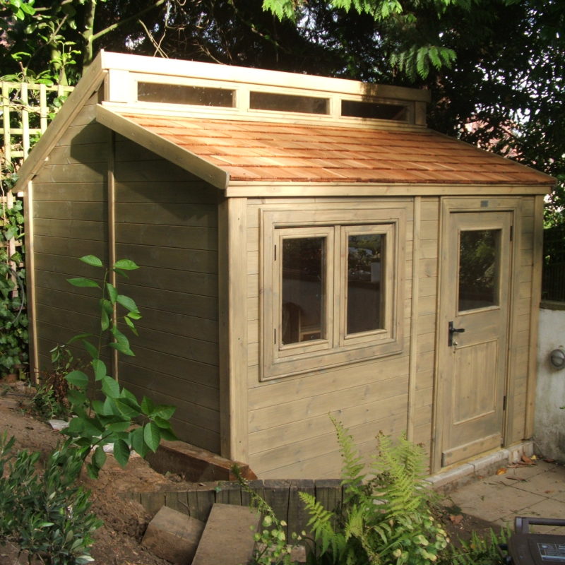 Contemporary Shed with cedar roof shingles