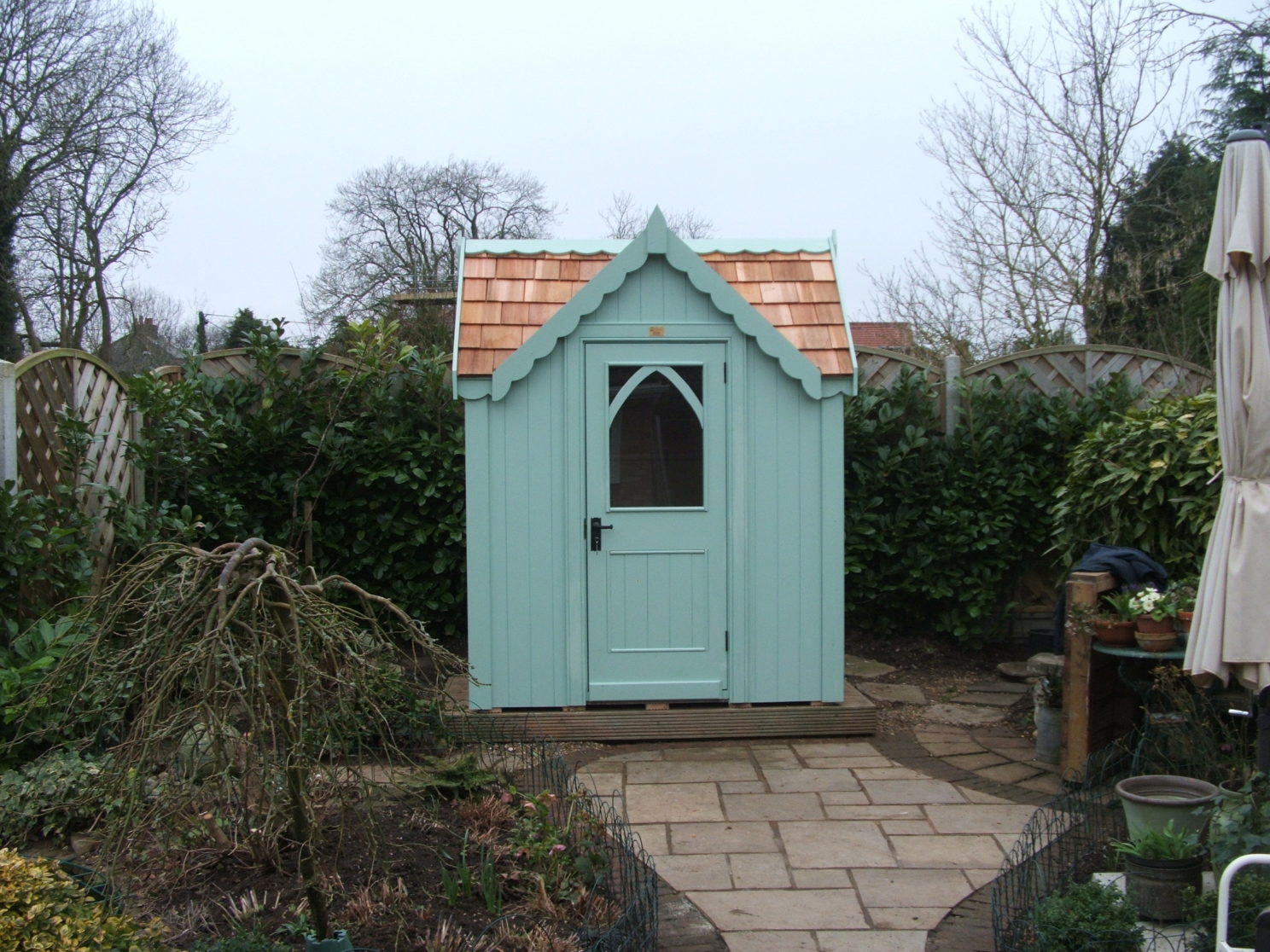 Posh shed with gable over door