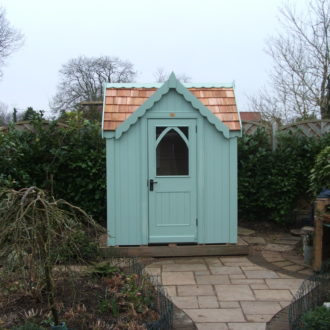Posh shed with gable over door